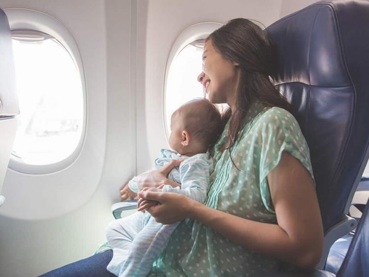 What should be considered when traveling by plane with a baby?